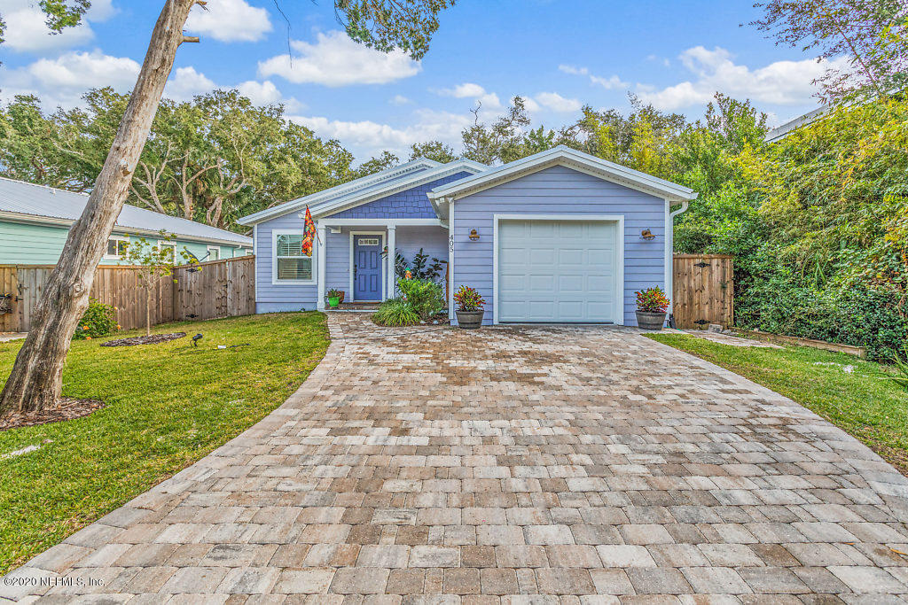 405 2nd Street St. Augustine, FL 32084 - Photo 8 of 49 a view of a house with yard and a garage