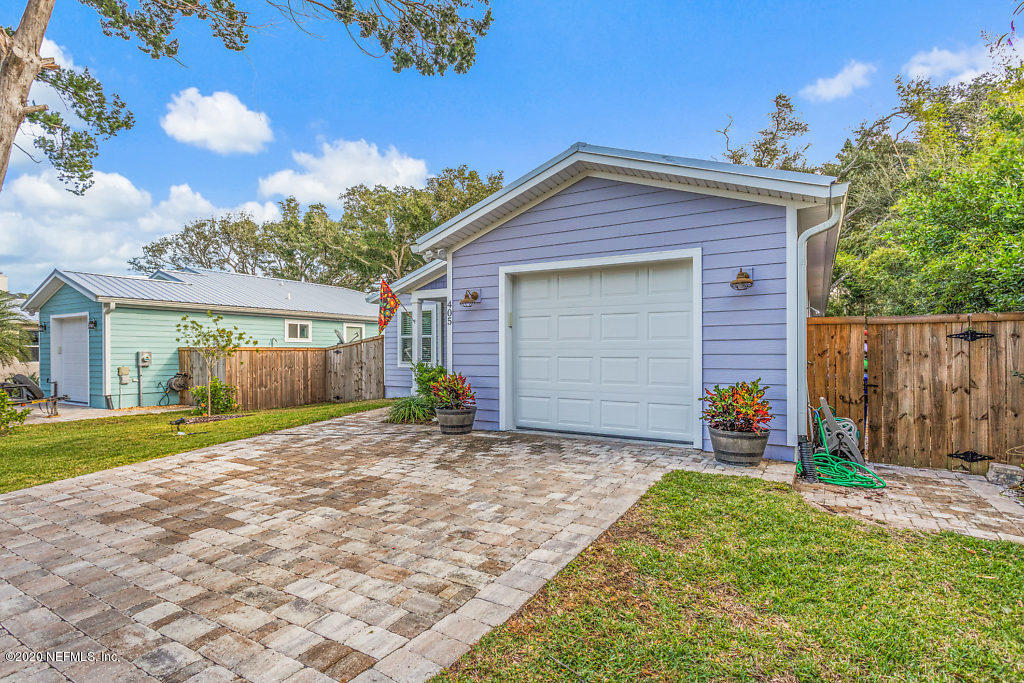 405 2nd Street St. Augustine, FL 32084 - Photo 9 of 49 a view of a house with a yard and potted plants