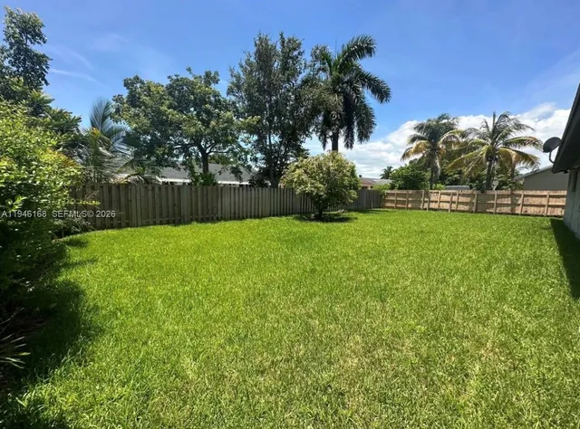 a view of a backyard with a garden