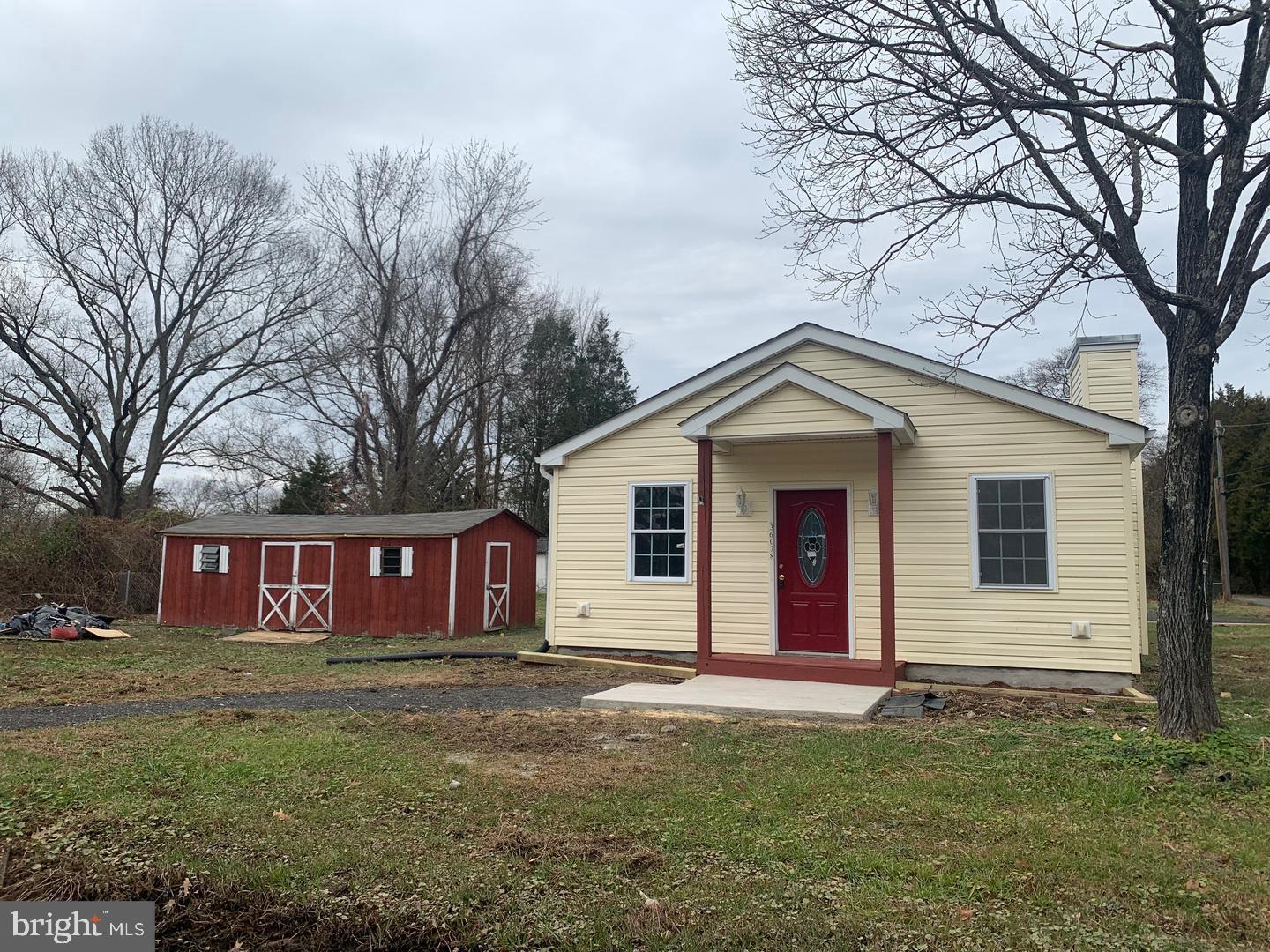 36078 Carver Road Chaptico, MD 20621 - Photo 1 of 14 a view of a house with a yard and garage