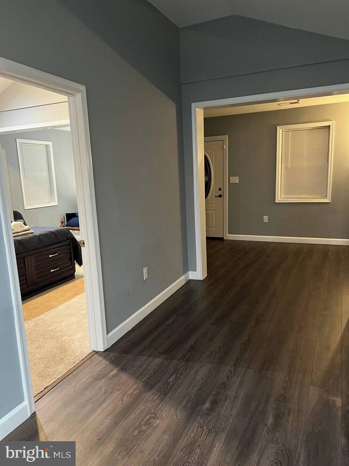 36078 Carver Road Chaptico, MD 20621 - Photo 13 of 14 a view of a hallway with wooden floor and a bathroom