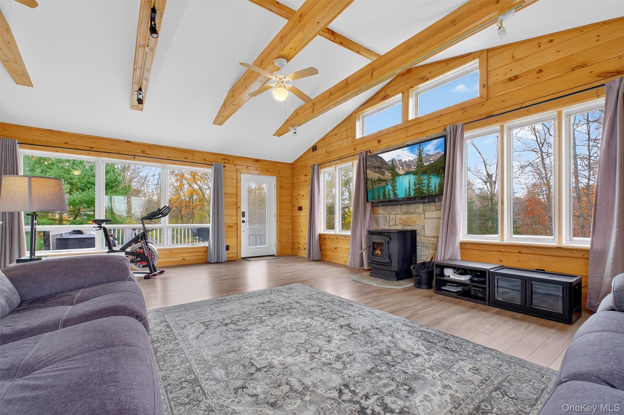 618 Salt Point Turnpike Poughkeepsie, NY 12601 - Photo 17 of 38 a living room with fireplace furniture and a large window