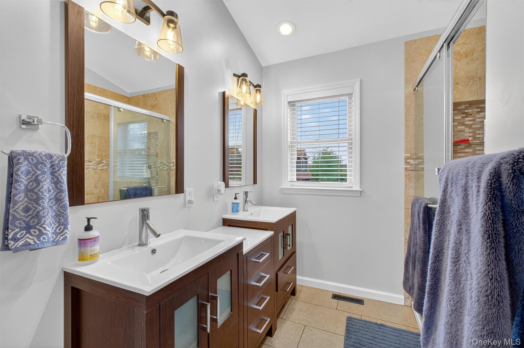 618 Salt Point Turnpike Poughkeepsie, NY 12601 - Photo 18 of 38 a bathroom with double vanity and a mirror