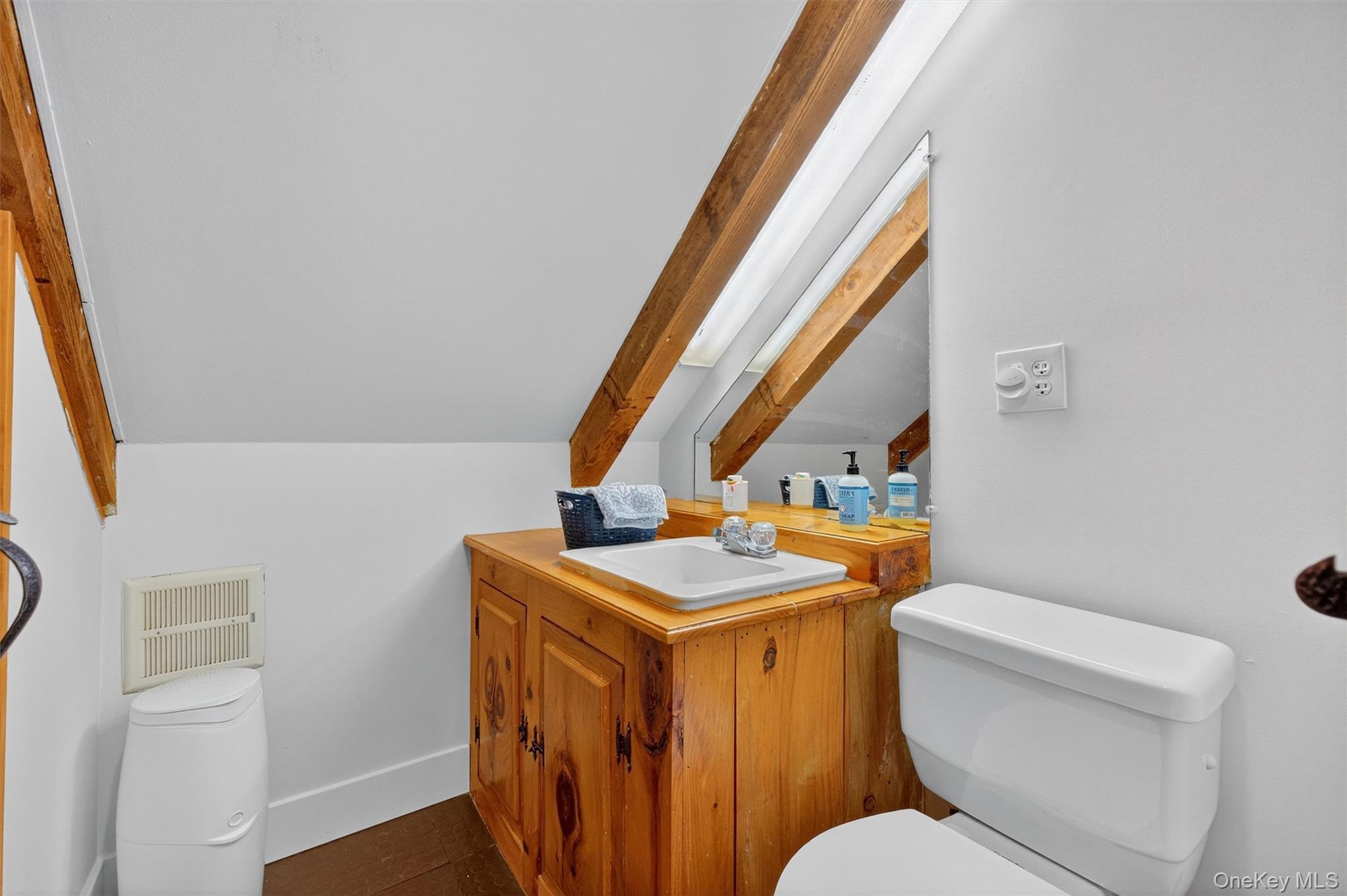 618 Salt Point Turnpike Poughkeepsie, NY 12601 - Photo 24 of 38 a bathroom with a toilet a sink and a mirror