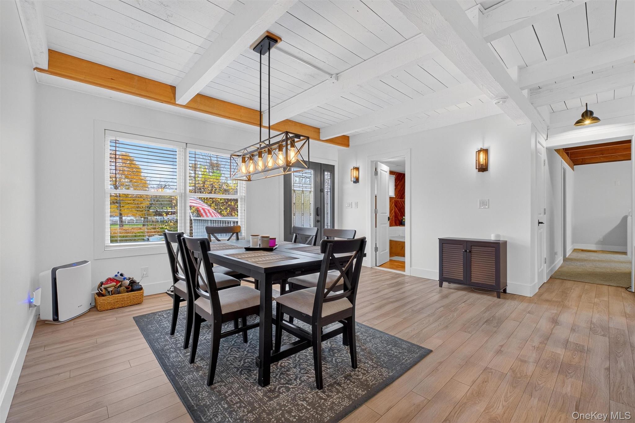 618 Salt Point Turnpike Poughkeepsie, NY 12601 - Photo 9 of 38 a dining room with furniture window and wooden floor