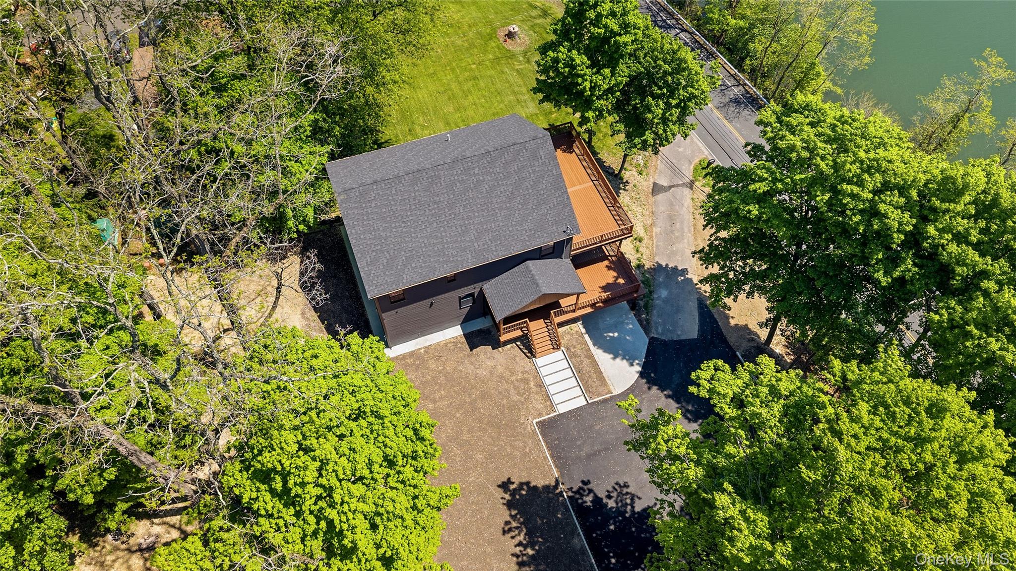 548 Lakes Road Monroe, NY 10950 - Photo 3 of 50 an aerial view of a house with yard and outdoor seating