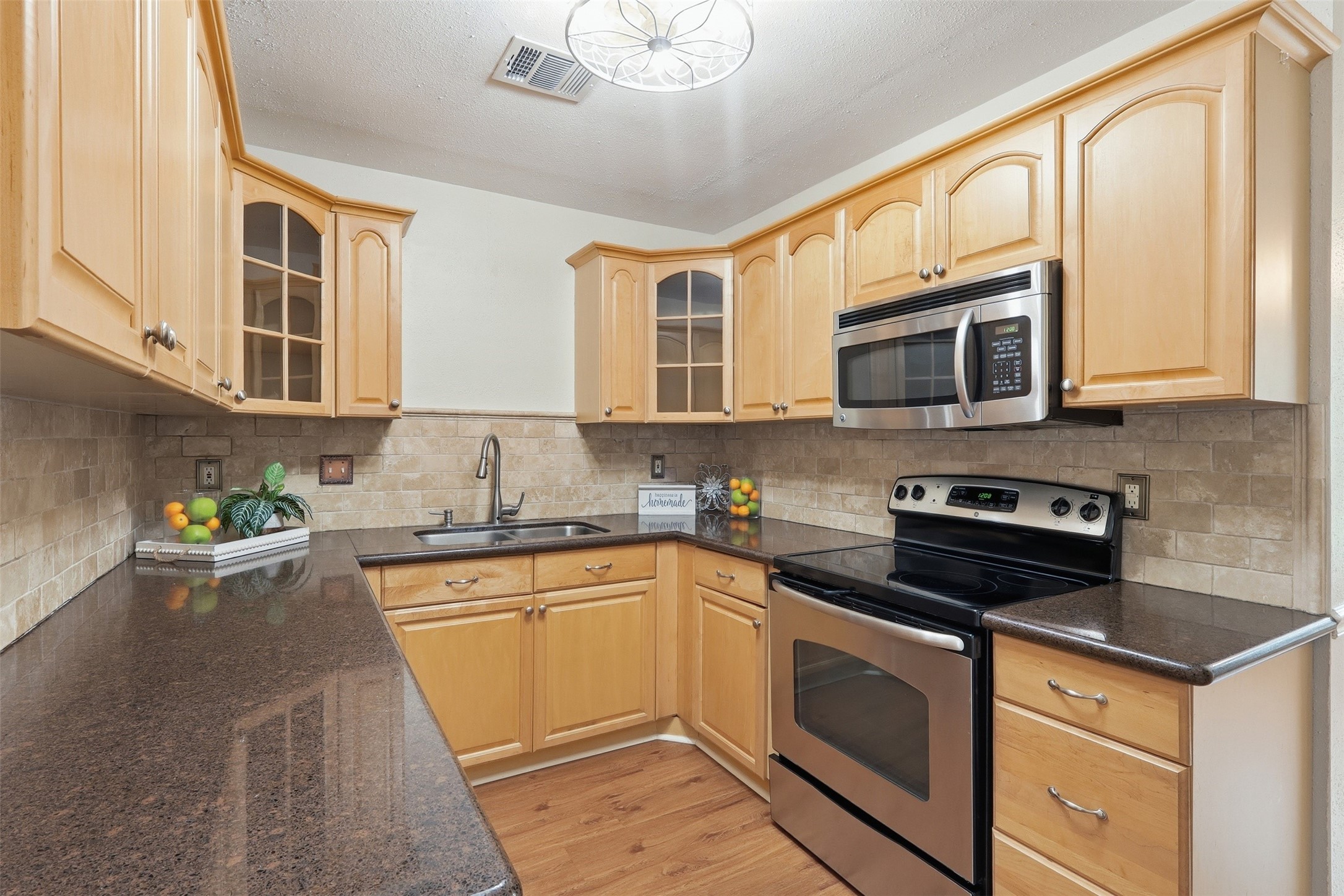 10 East Broken Oak Court Spring, TX 77381 - Photo 13 of 47 Cozy kitchen with generous cabinet space, a perfect place to build memories cooking with loved ones.