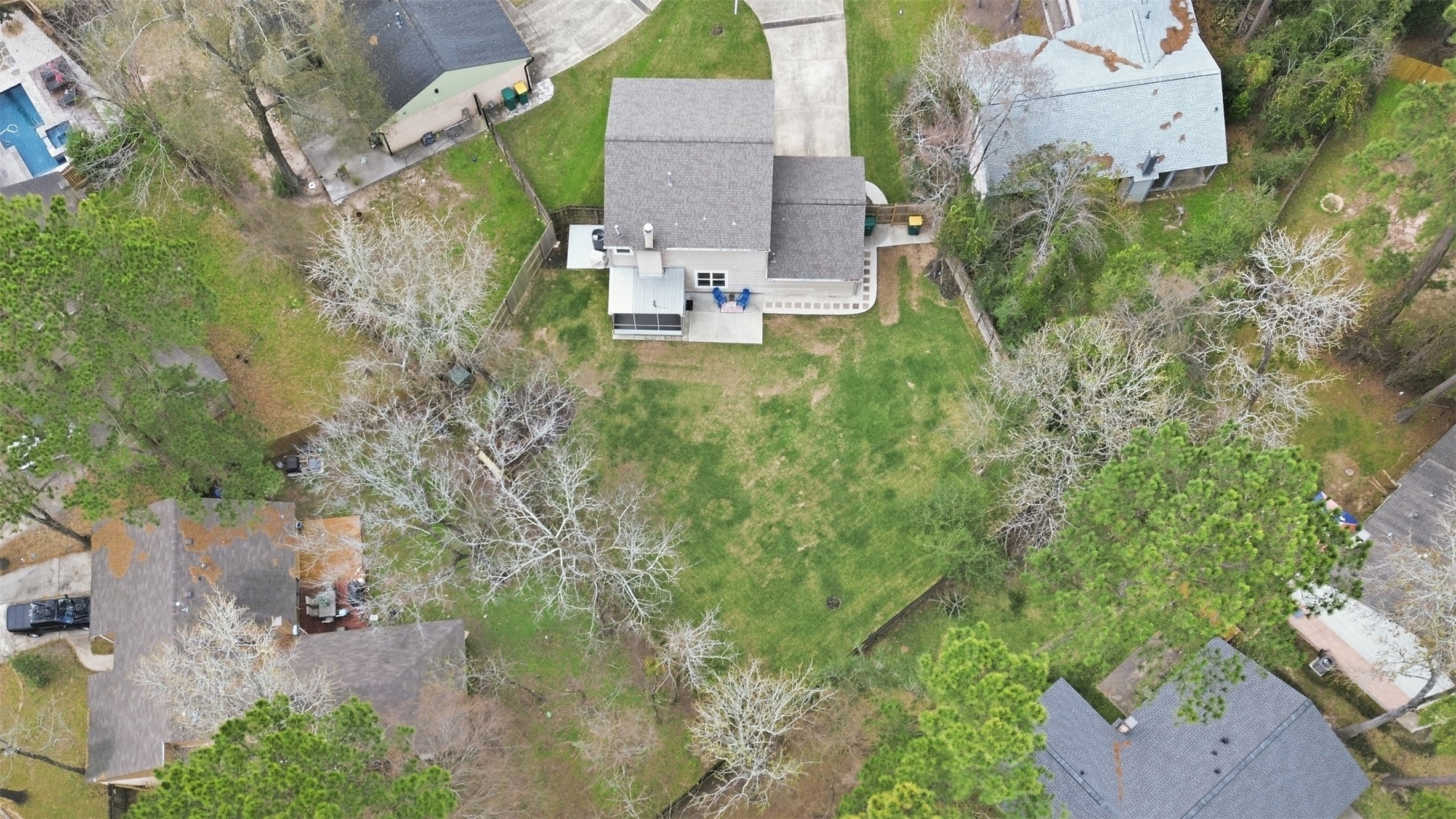 10 East Broken Oak Court Spring, TX 77381 - Photo 42 of 47 This aerial photo shows a spacious property with a large backyard, surrounded by mature trees. The house offers ample outdoor space for activities and relaxation.