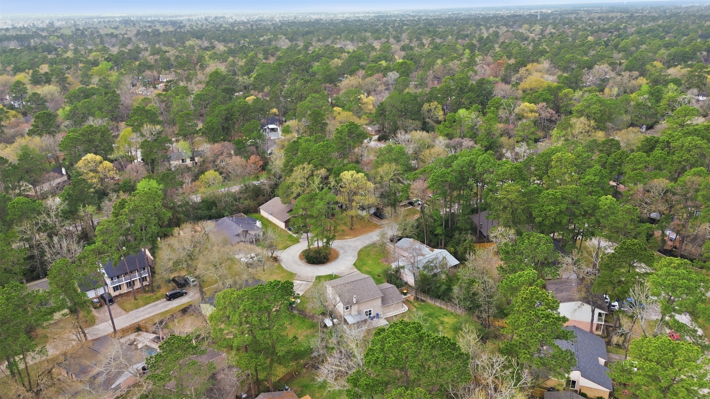 10 East Broken Oak Court Spring, TX 77381 - Photo 44 of 47 This aerial photo showcases a peaceful suburban neighborhood surrounded by lush greenery and mature trees.