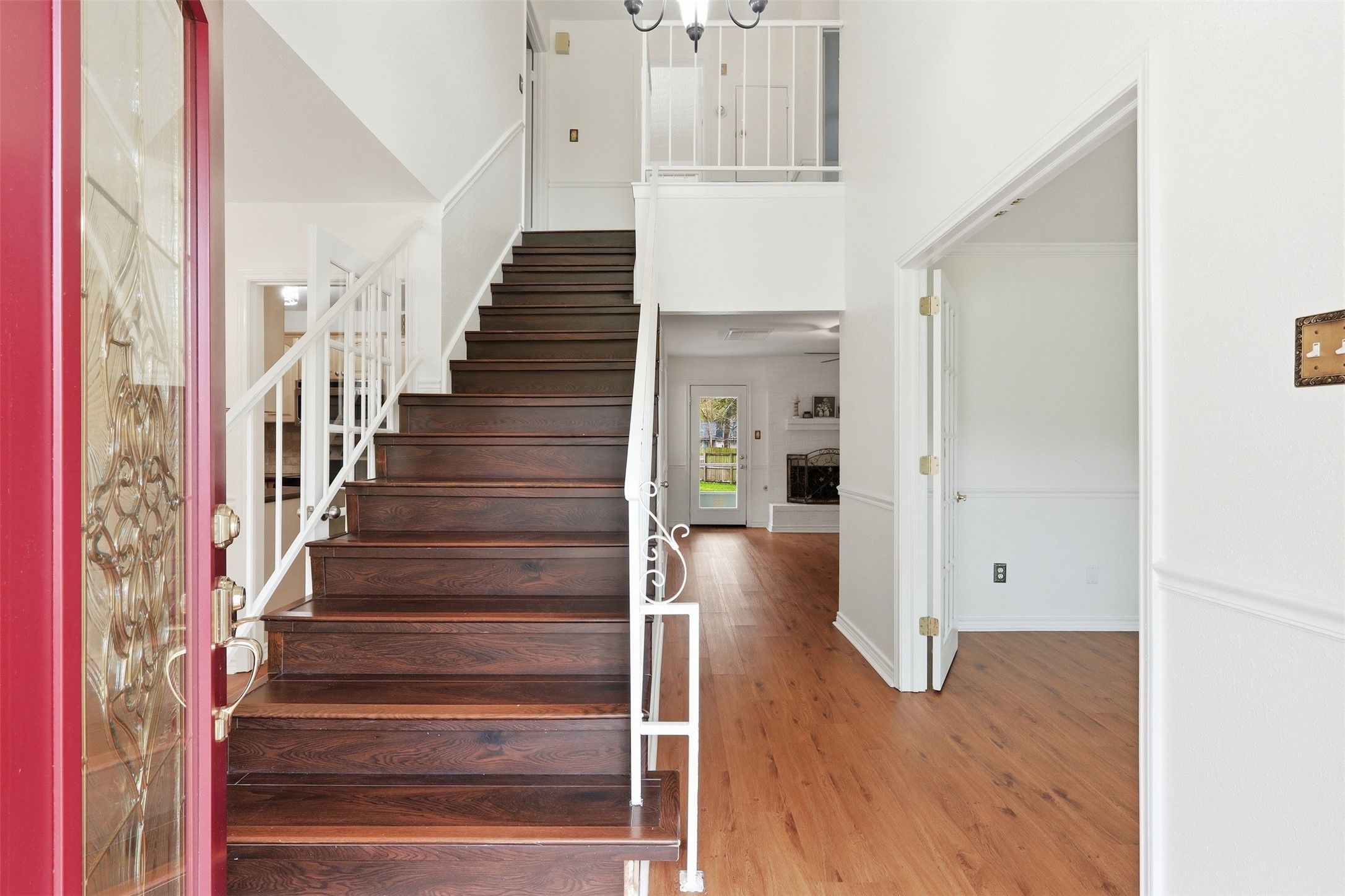 10 East Broken Oak Court Spring, TX 77381 - Photo 8 of 47 This inviting entryway features a stylish staircase and opens into a bright living room.