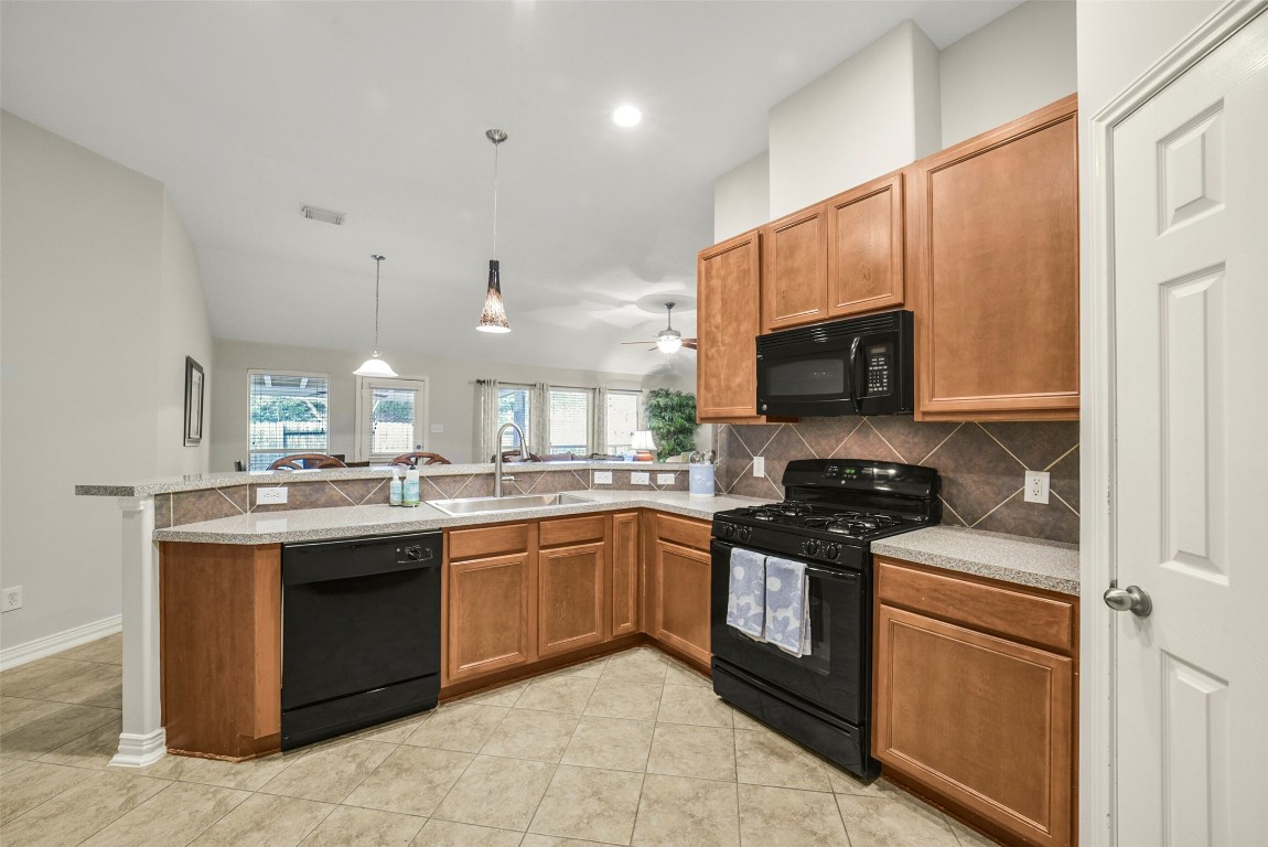 25103 Diamond Ranch Drive Katy, TX 77494 - Photo 14 of 34 There are plenty of cabinets and counterspace in this kitchen.