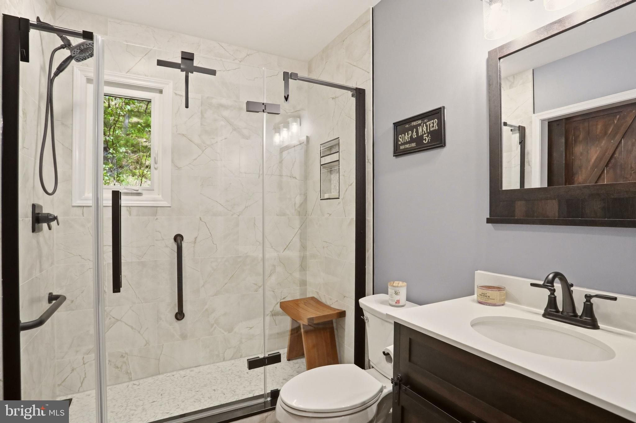 19897 Foresthill Road Bluemont, VA 20135 - Photo 21 of 39 a bathroom with a sink toilet and shower