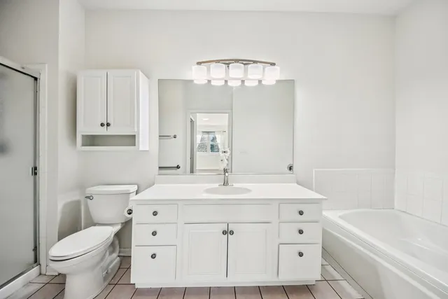 a bathroom with a sink a toilet and a bathtub