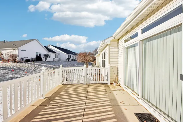 a view of a balcony with wooden floor