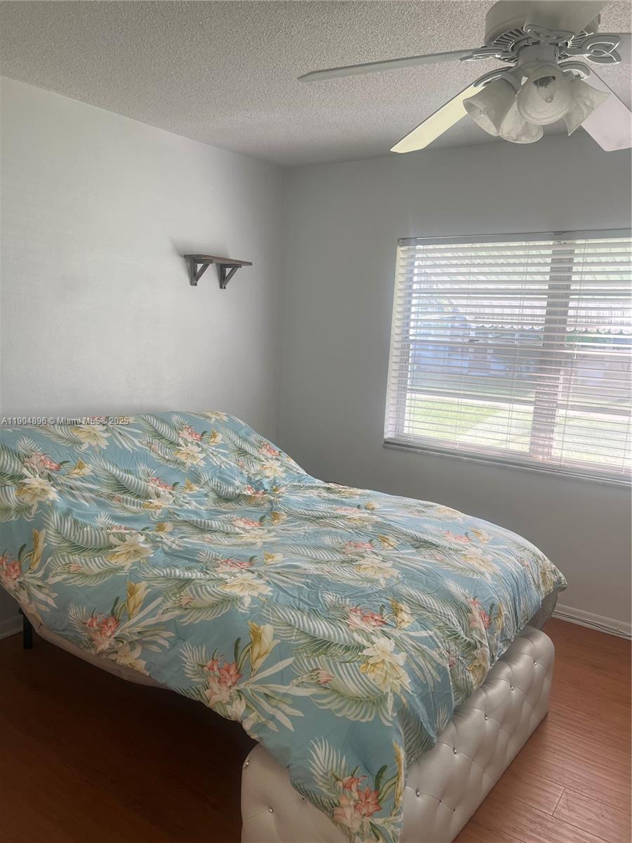 2501 West Golf Boulevard, Unit 128 Pompano Beach, FL 33064 - Photo 12 of 51 a bedroom with a bed and a window