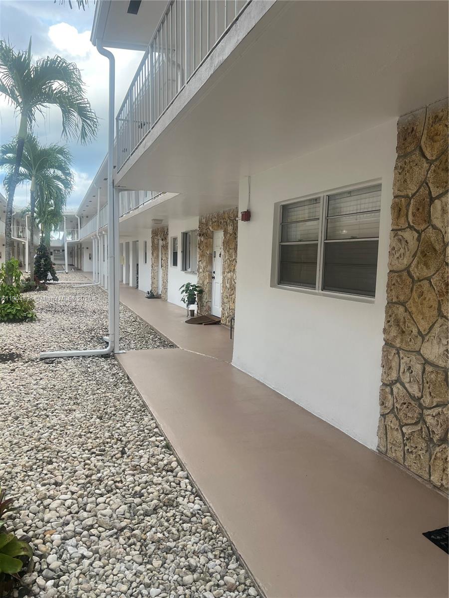 2501 West Golf Boulevard, Unit 128 Pompano Beach, FL 33064 - Photo 25 of 51 a view of a parking space in front of a building