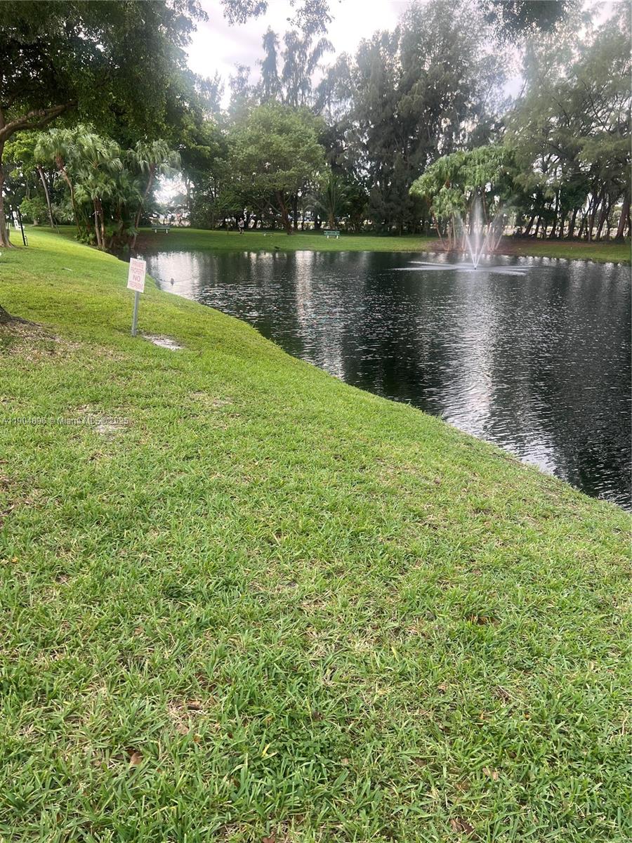 2501 West Golf Boulevard, Unit 128 Pompano Beach, FL 33064 - Photo 30 of 51 a large body of water next to a lake with a building in the background