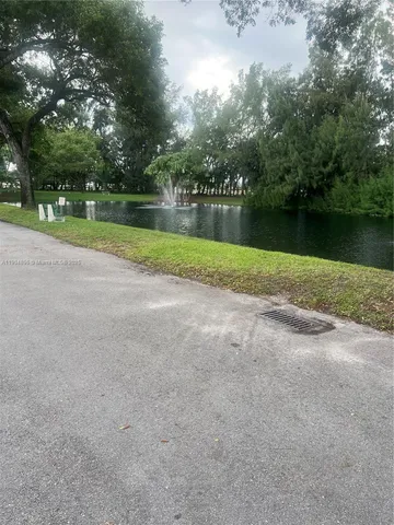 a garden view with a fountain