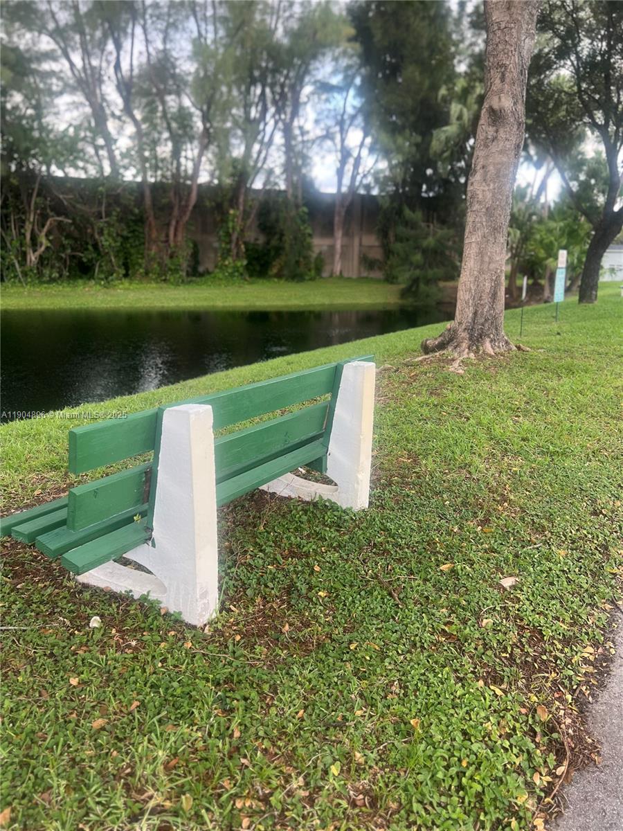 2501 West Golf Boulevard, Unit 128 Pompano Beach, FL 33064 - Photo 33 of 51 a garden view with a fountain