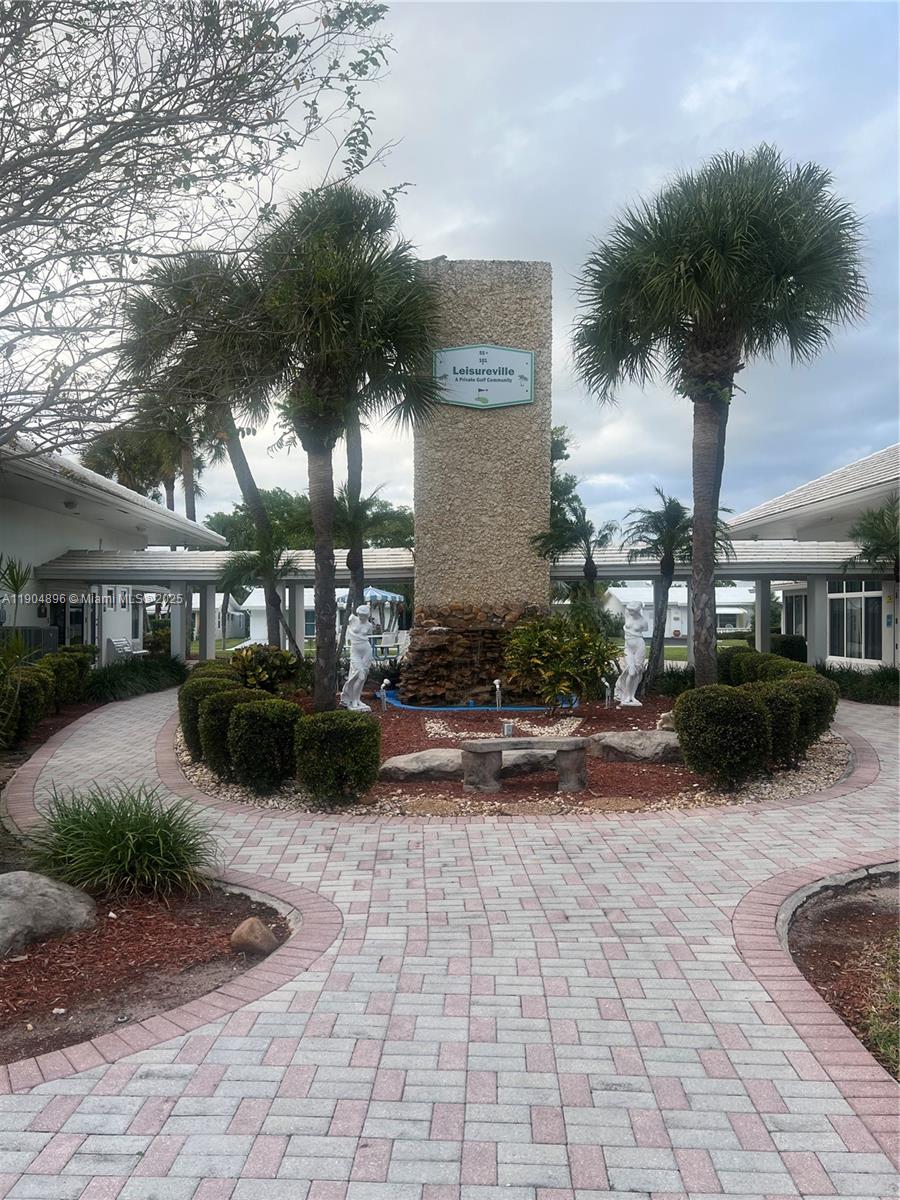 2501 West Golf Boulevard, Unit 128 Pompano Beach, FL 33064 - Photo 36 of 51 a view of a house with backyard porch and sitting area