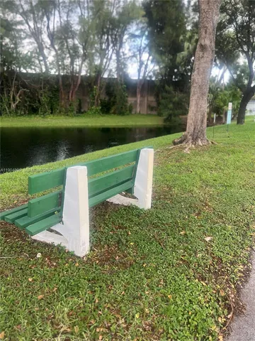a view of a house with a yard and plants