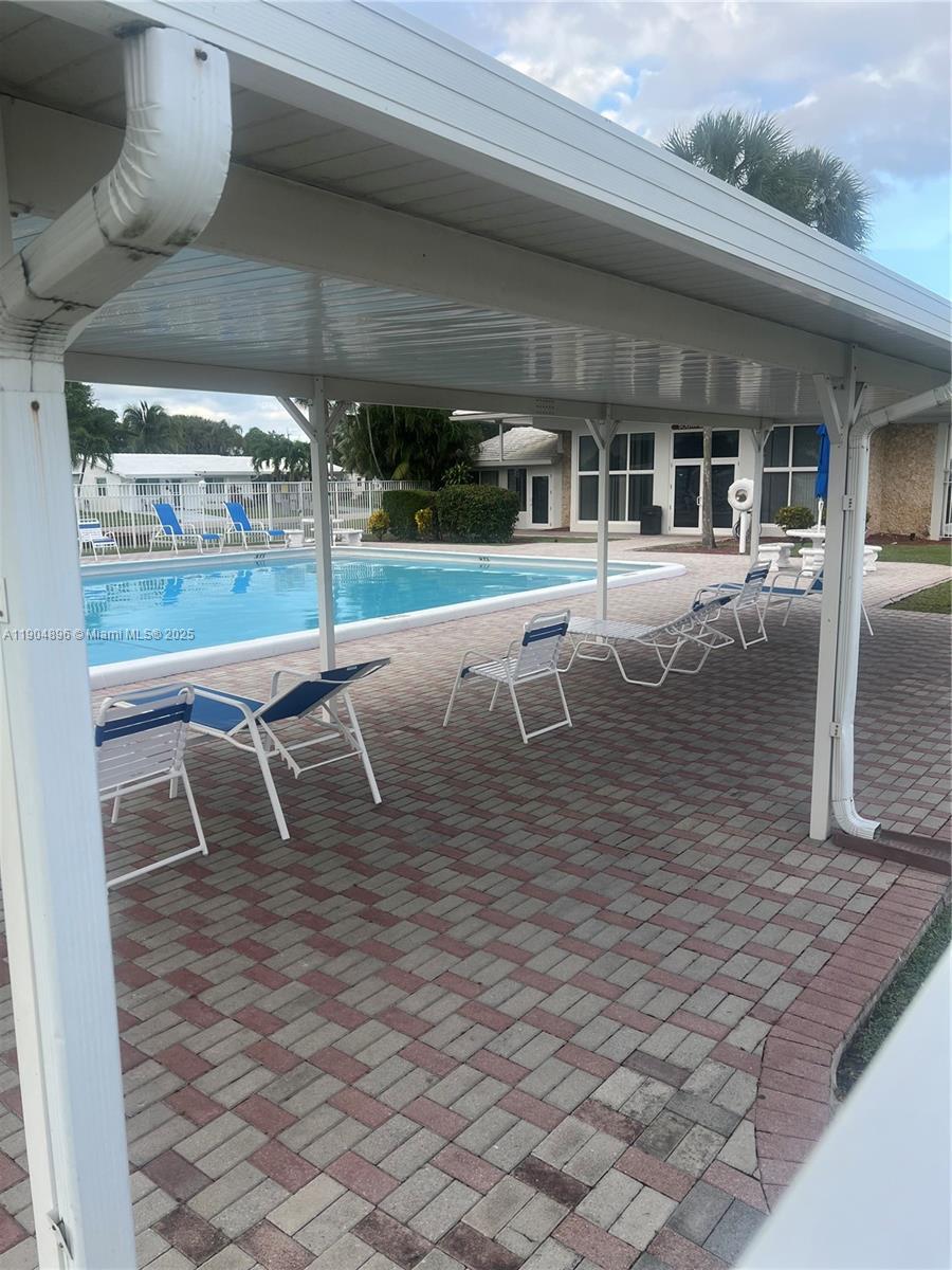 2501 West Golf Boulevard, Unit 128 Pompano Beach, FL 33064 - Photo 40 of 51 an outdoor space with swimming pool