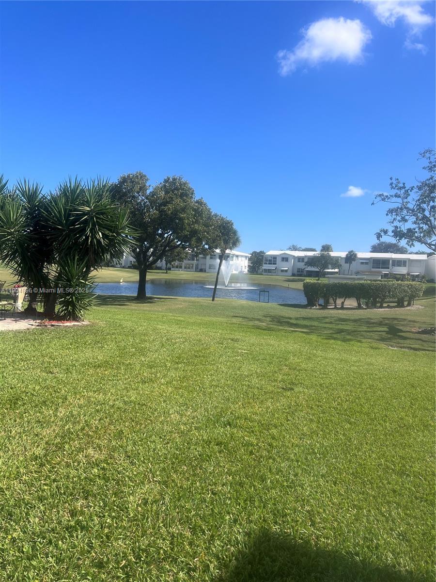 2501 West Golf Boulevard, Unit 128 Pompano Beach, FL 33064 - Photo 43 of 51 a view of pool and mountain
