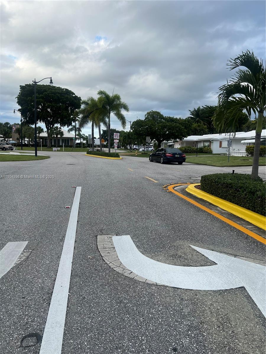 2501 West Golf Boulevard, Unit 128 Pompano Beach, FL 33064 - Photo 45 of 51 a view of street with houses