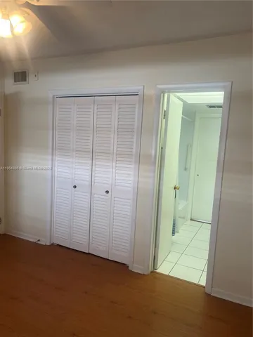 an empty room with an entryway door