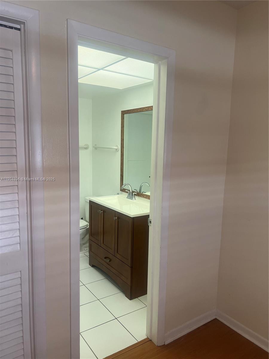 2501 West Golf Boulevard, Unit 128 Pompano Beach, FL 33064 - Photo 10 of 51 a bathroom with a sink and a mirror