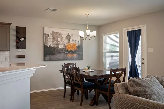 a view of a dining room with furniture window and outside view