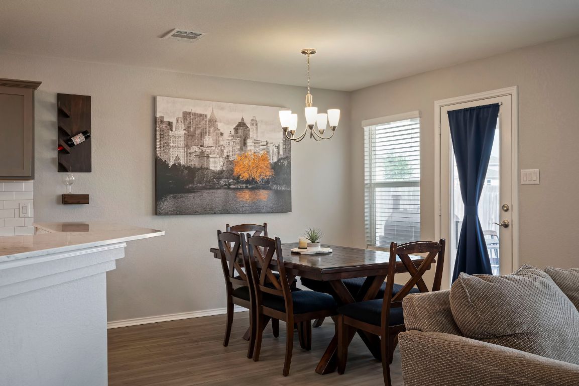 19417 James Carter Jr Street Manor, TX 78653 - Photo 12 of 37 a view of a dining room with furniture window and outside view