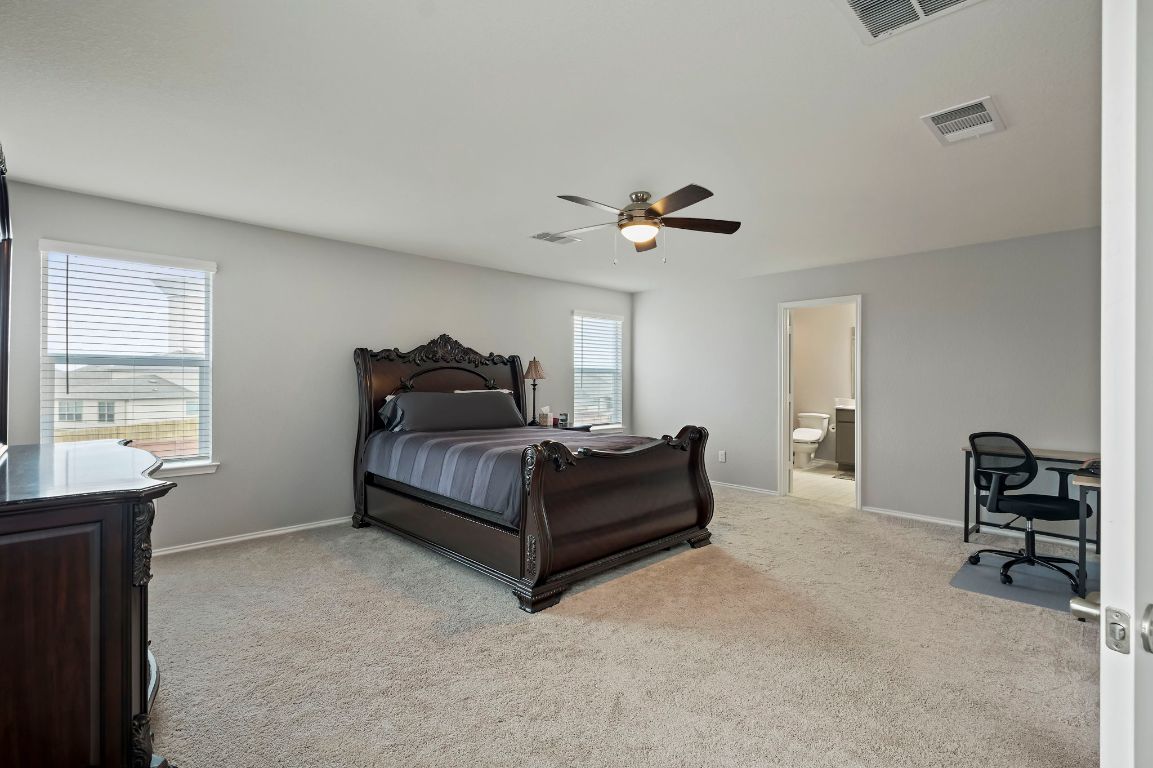 19417 James Carter Jr Street Manor, TX 78653 - Photo 19 of 37 a living room with furniture and a window