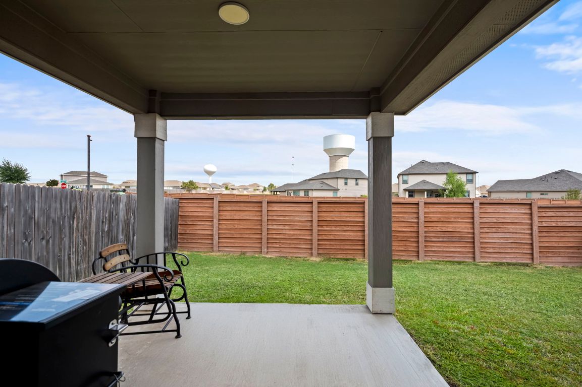 19417 James Carter Jr Street Manor, TX 78653 - Photo 27 of 37 a view of a chair and table in the garden