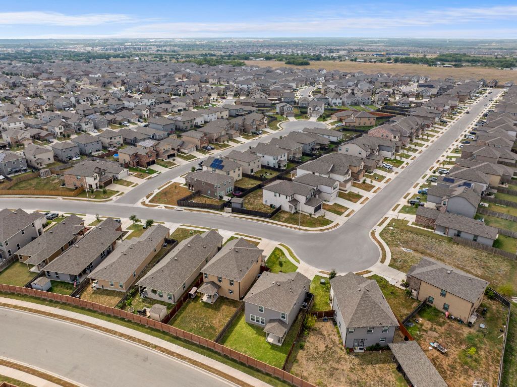 19417 James Carter Jr Street Manor, TX 78653 - Photo 35 of 37 an aerial view of a residential houses with outdoor space