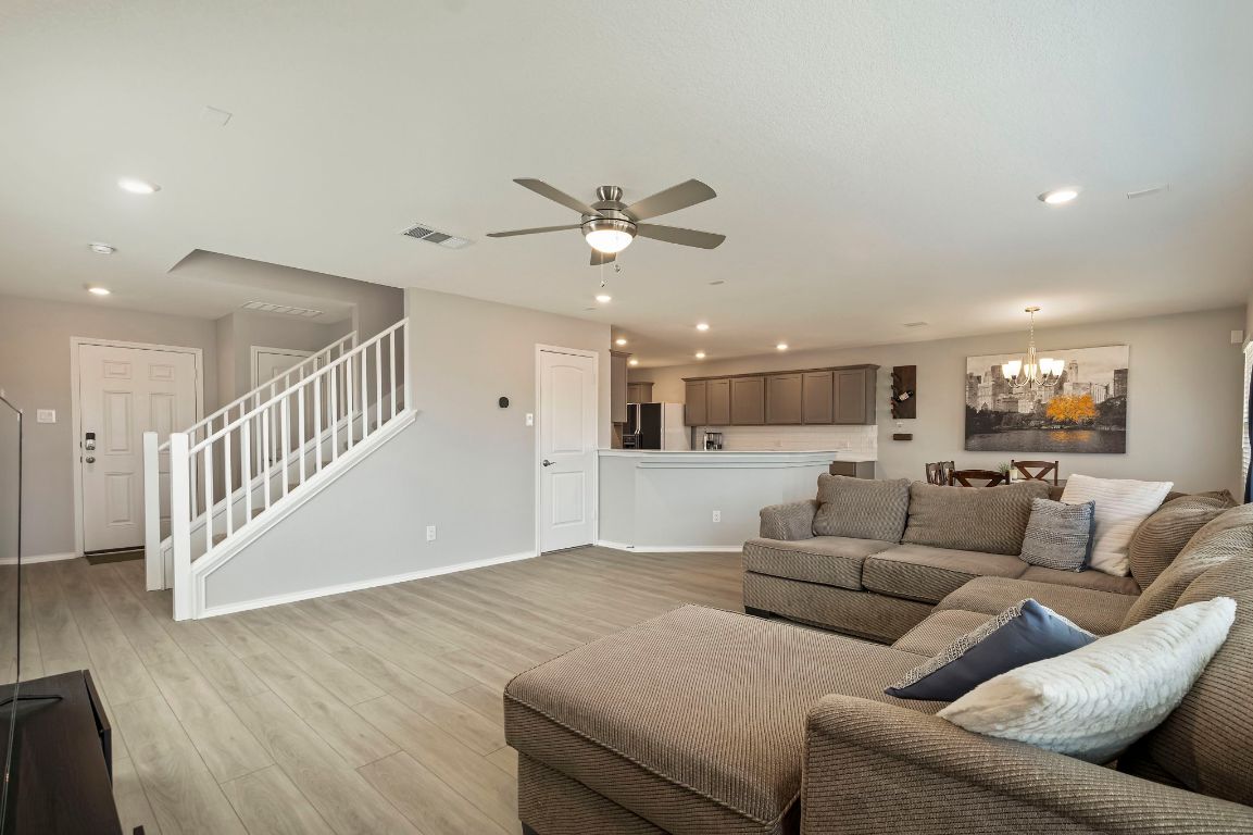 19417 James Carter Jr Street Manor, TX 78653 - Photo 5 of 37 a living room with furniture and wooden floor