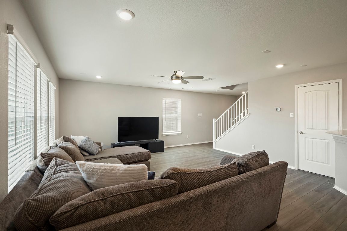 19417 James Carter Jr Street Manor, TX 78653 - Photo 6 of 37 a living room with furniture and a flat screen tv