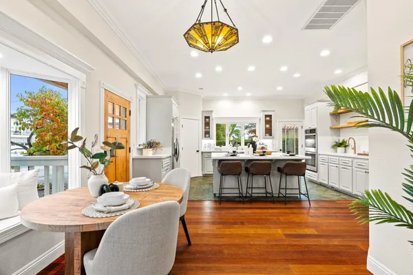a view of a dining room with furniture window and wooden floor