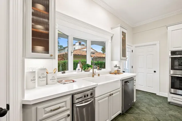 a living room with a couch and a wooden floor