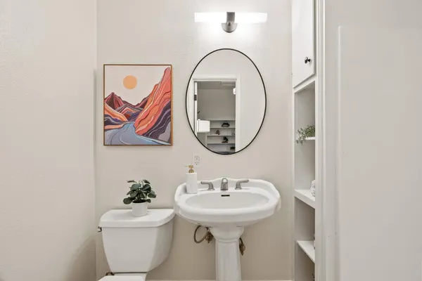 a bedroom with a bed and glass door