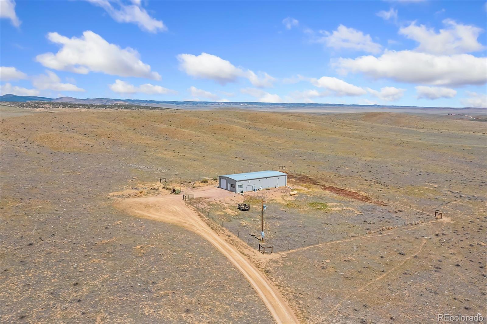 20179 Rawhide Flats Road Wellington, CO 80549 - Photo 1 of 12 a view of an ocean and beach