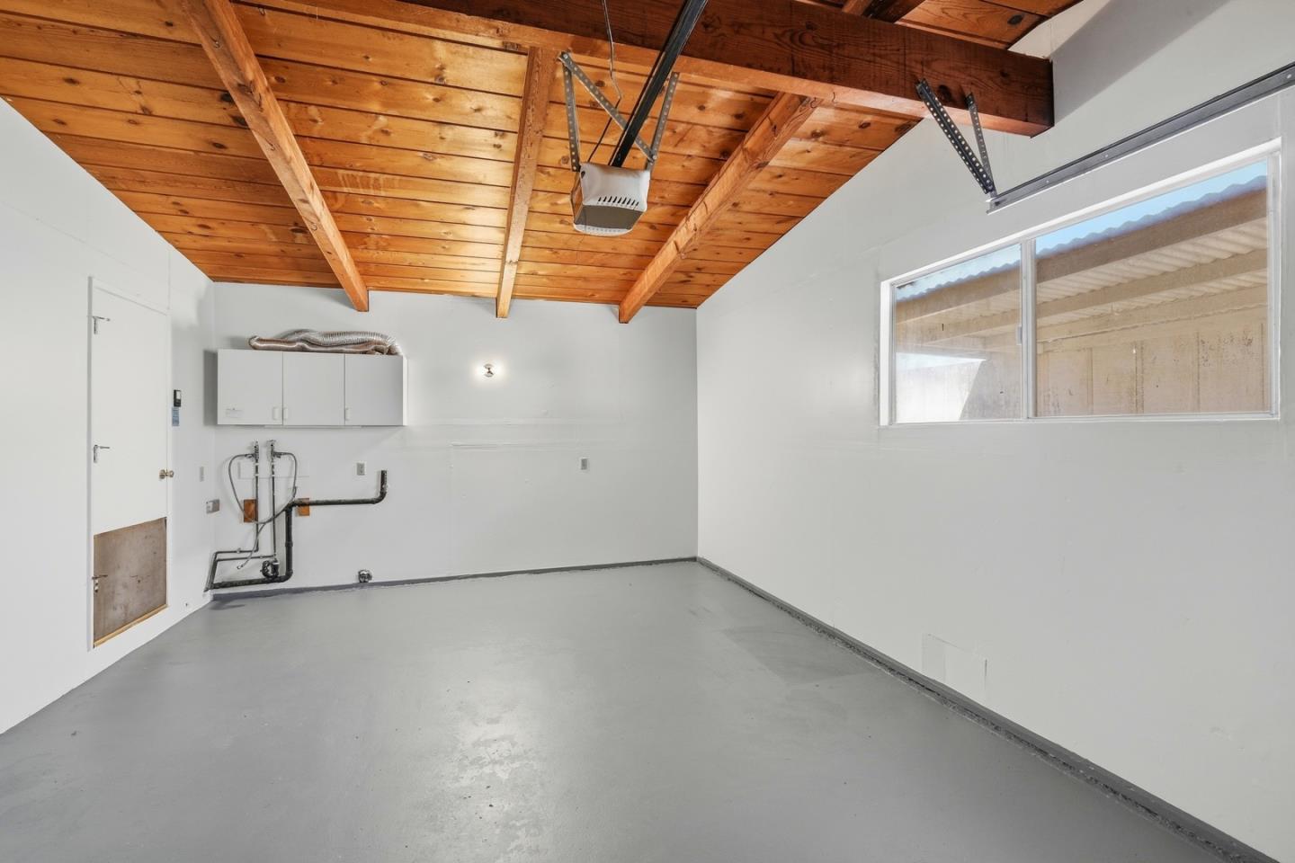 215 Manfre Road Watsonville, CA 95076 - Photo 26 of 36 a view of a room with window and wooden floor