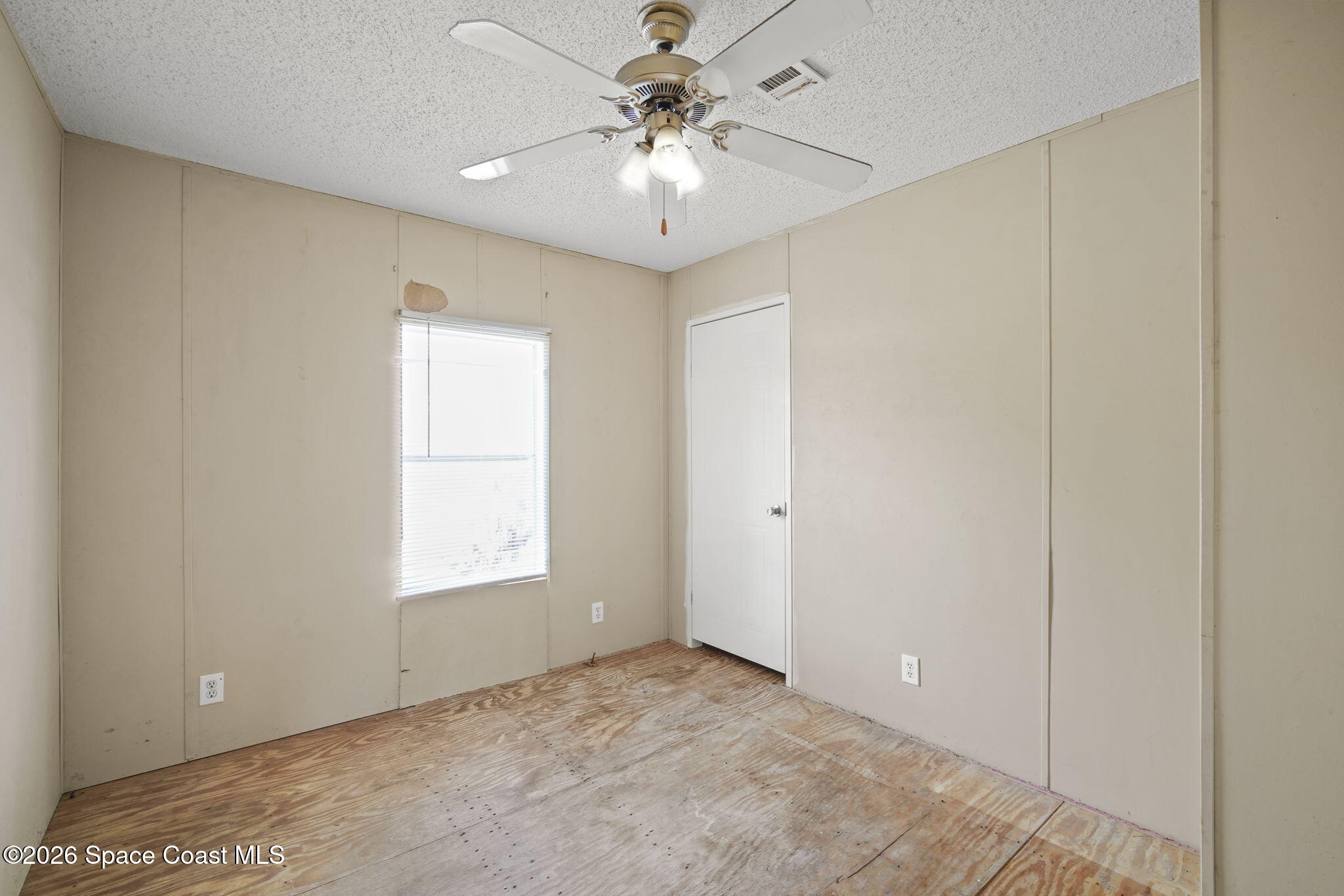 3918 East Ridgewood Drive Cocoa, FL 32926 - Photo 16 of 27 a view of an empty room with a window