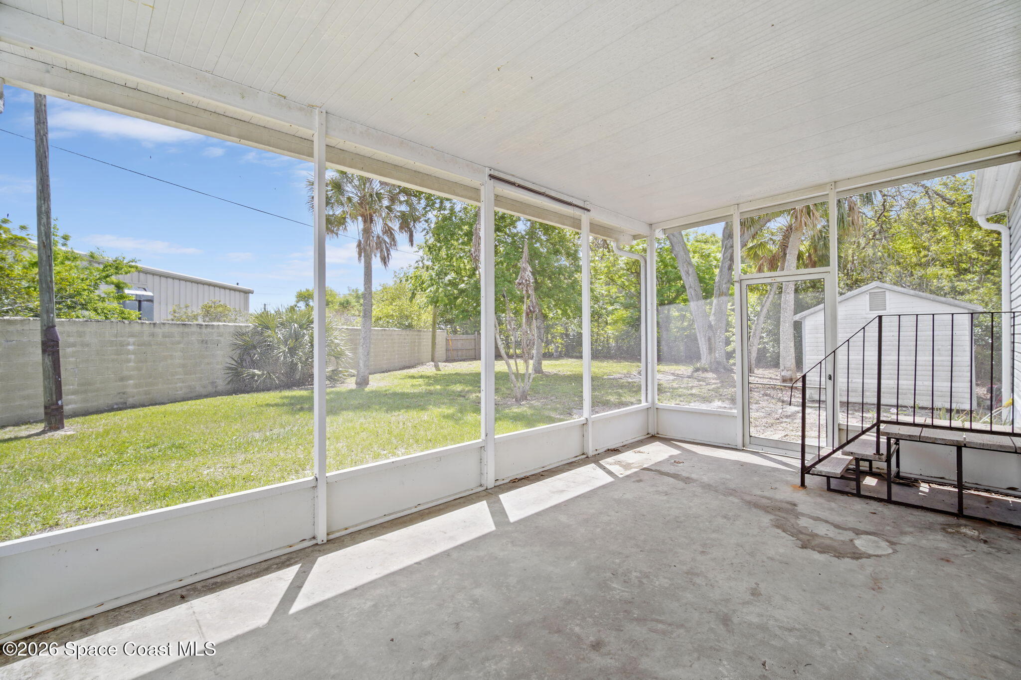 3918 East Ridgewood Drive Cocoa, FL 32926 - Photo 25 of 27 a view of a living room and balcony