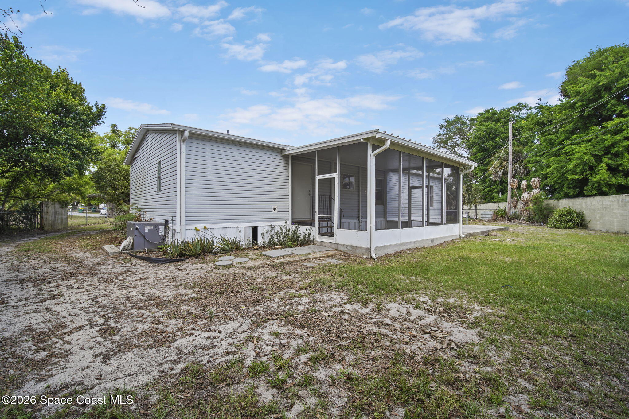 3918 East Ridgewood Drive Cocoa, FL 32926 - Photo 27 of 27 a view of a house with yard and a garden
