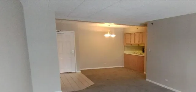 a bedroom with bed and glass door