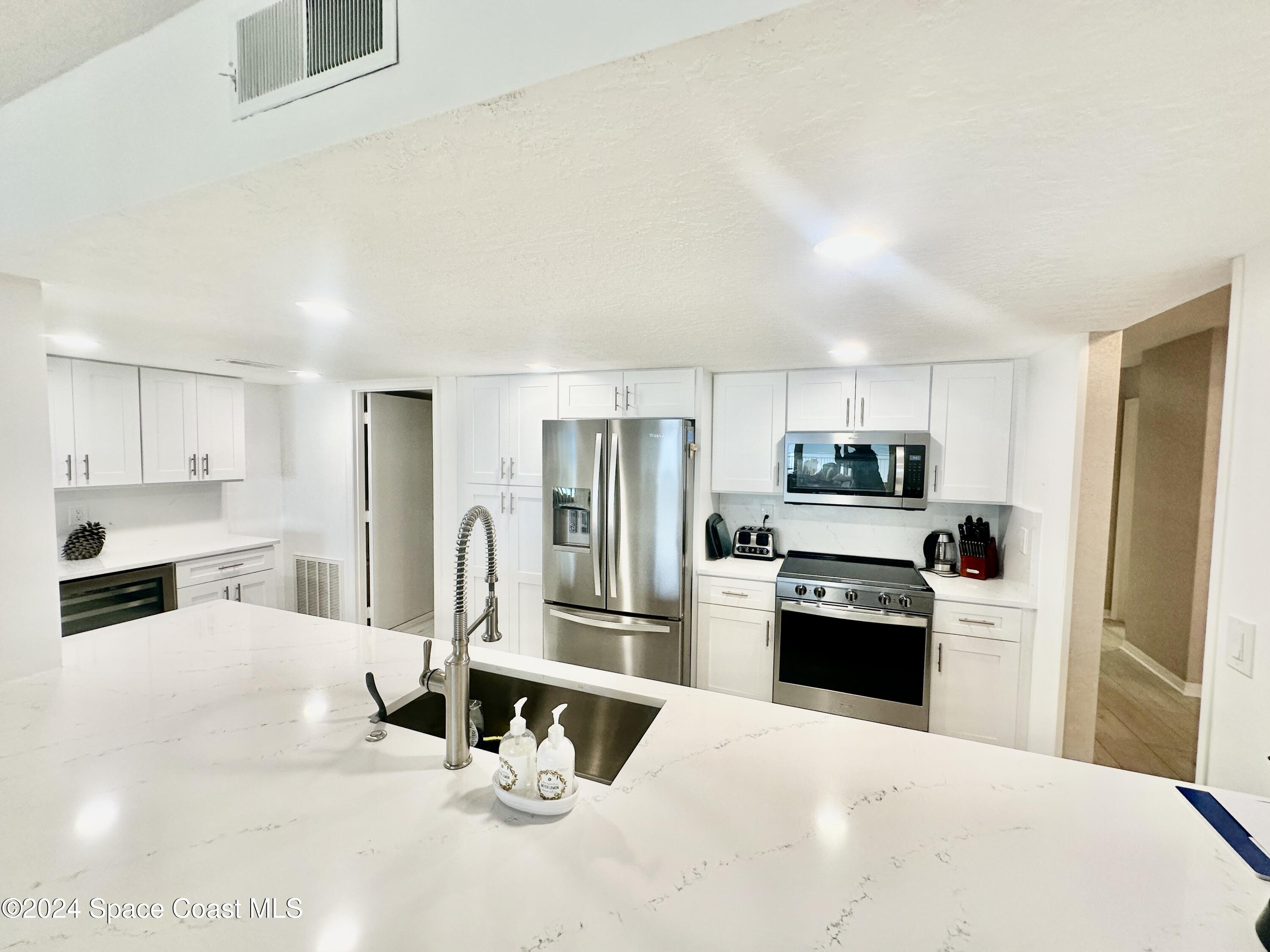 6770 Ridgewood Avenue, Unit 1103 Cocoa Beach, FL 32931 - Photo 5 of 32 IMG_E4050