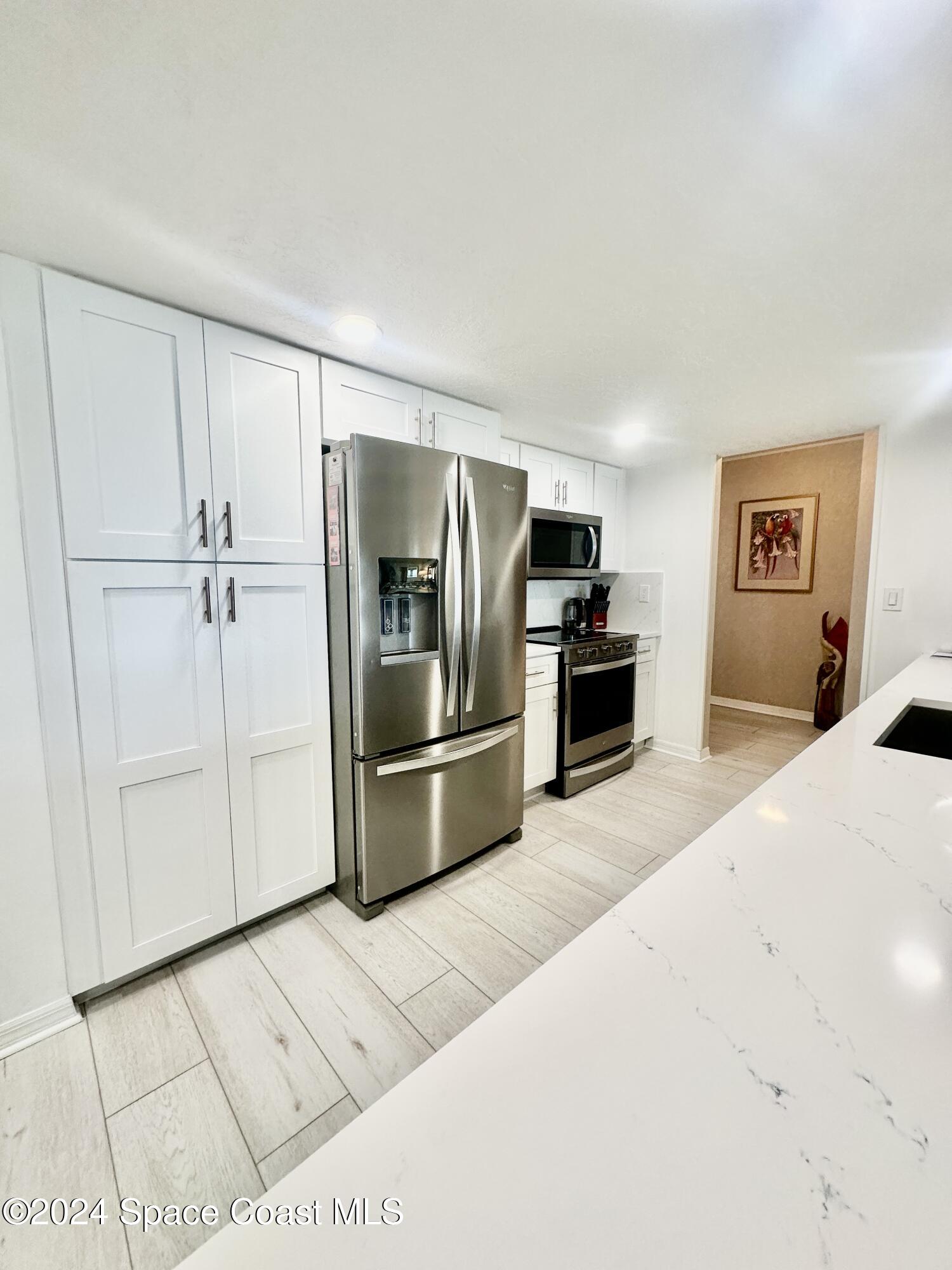 6770 Ridgewood Avenue, Unit 1103 Cocoa Beach, FL 32931 - Photo 8 of 32 IMG_E4048