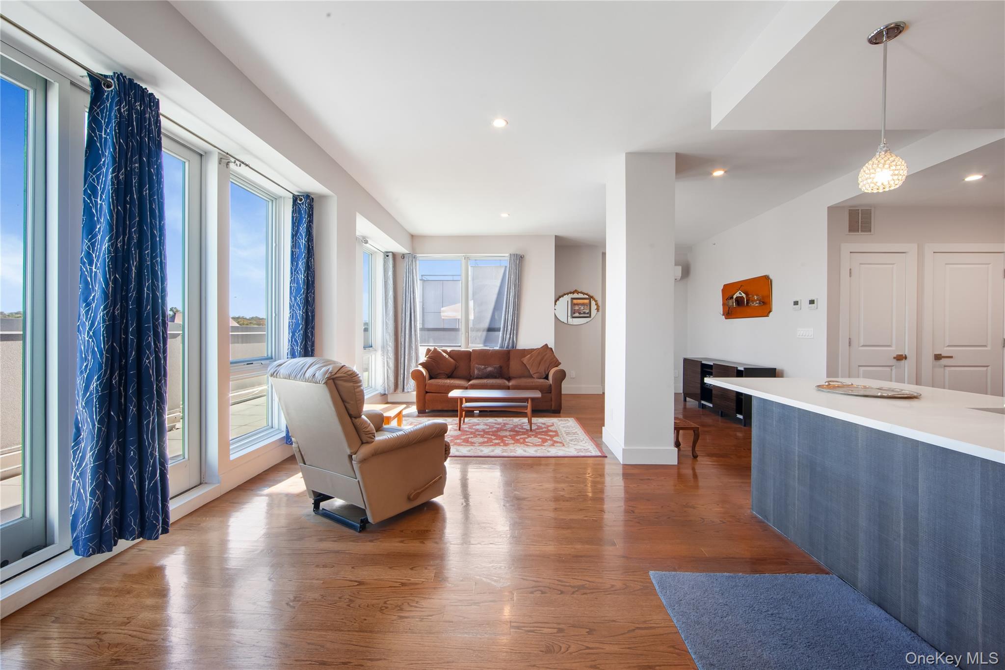 109-19 72nd Road, Unit 7B Queens, NY 11375 - Photo 5 of 17 a living room with furniture and wooden floor