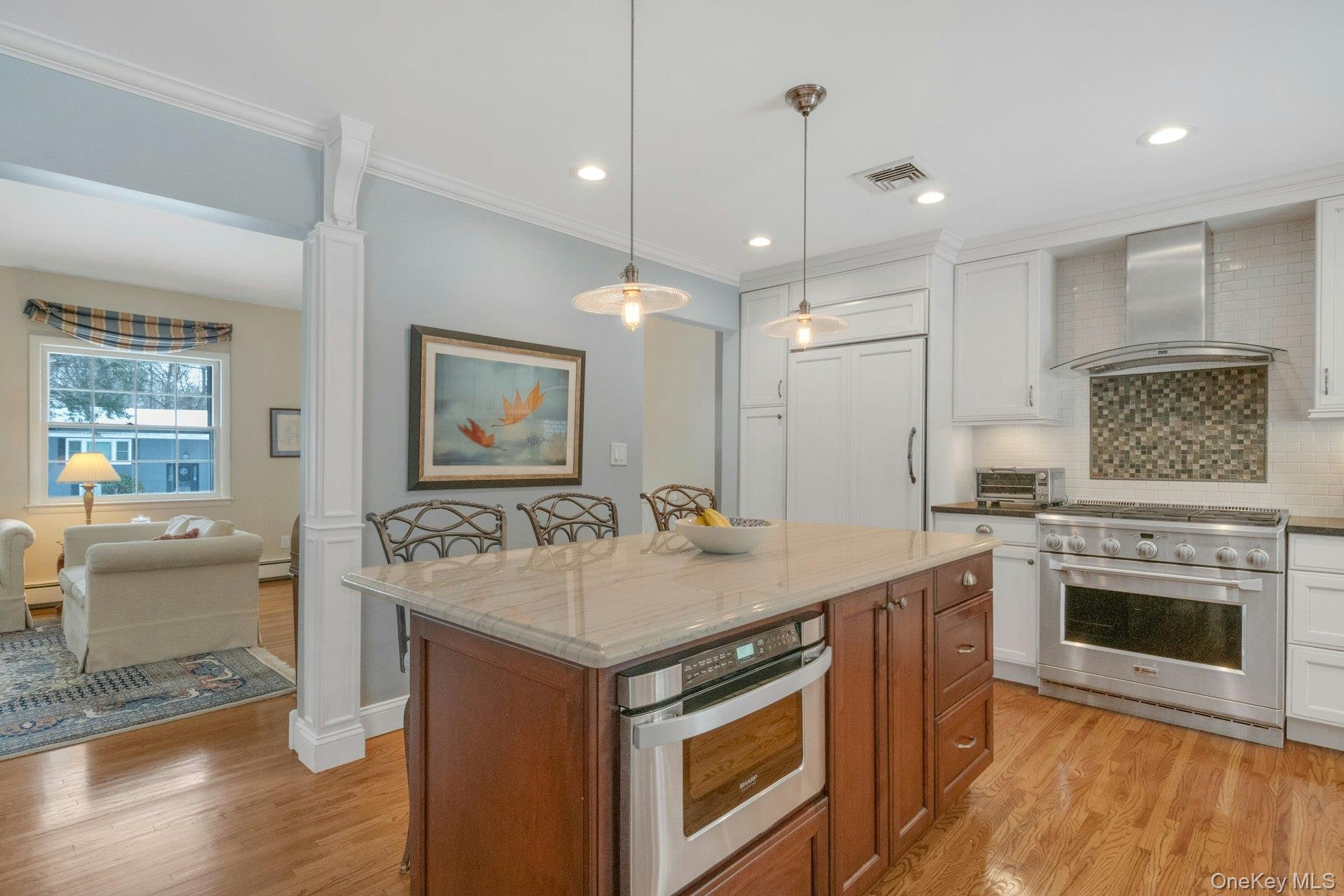 62 Whitson Road Briarcliff Manor, NY 10510 - Photo 11 of 46 Stunning Chef's Kitchen with large center island with new microwave under quartzite counter (2026).